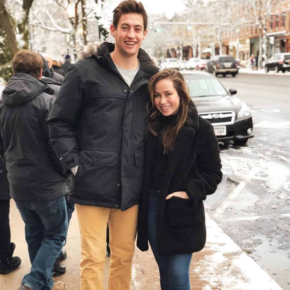 Sophia and boyfriend standing on sidewalk in 2018.
