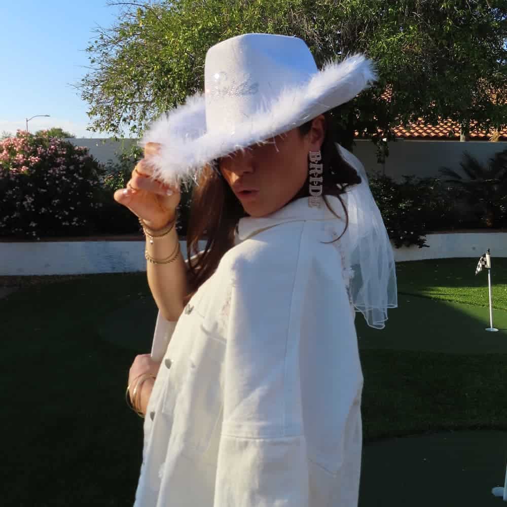 Sophia wearing a white cowgirl hat celebrating bachelorette party in 2023.